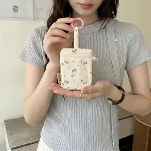 Floral print mini fabric key pouch with double zipper and cute pink ring for daily use.