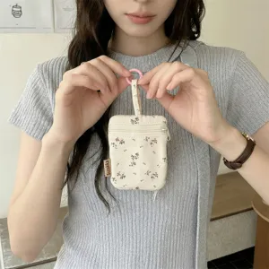 Ins style floral key pouch with double zippers and hanging ring, compact portable storage bag.