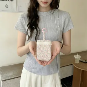 Floral key pouch detail showcasing the cute pattern, double zipper, and convenient hanging ring.