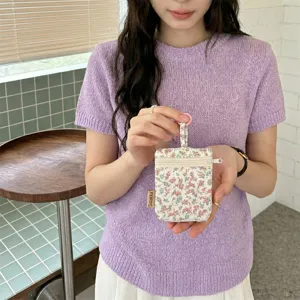 Floral print mini key pouch with double zippers and hanging loop, ideal for small items storage.