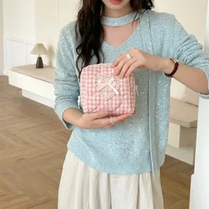 Pink plaid quilted cosmetic bag with cute heart lace bow detail for portable daily storage use.
