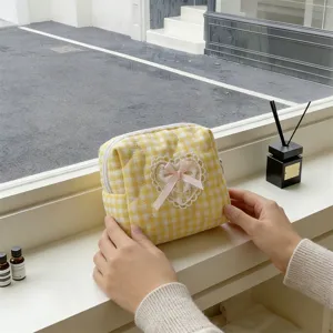 Yellow checkered quilted cosmetic bag with cute lace heart and pink bow for daily storage.