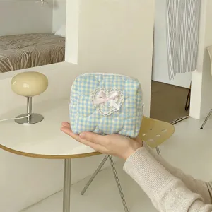 Blue and yellow plaid quilted cosmetic bag with cute lace heart and pink bow detail.