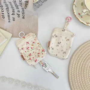 Ins floral key pouch with double zipper and hook, portable mini earphone storage.