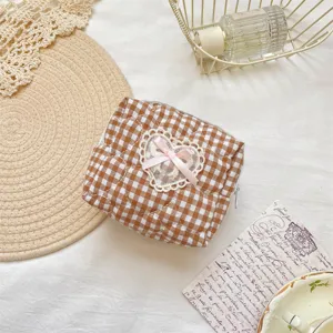 Brown gingham quilted cosmetic bag with cute lace heart and pink bow detail storage pouch.