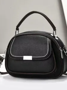 Elegante schwarze Handtasche aus Kunstleder mit Kontrastnähten und silbernen Beschlägen