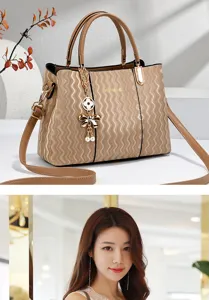 Elegant commuter women shoulder bag with wavy texture, metal hardware and pearl bow pendant.