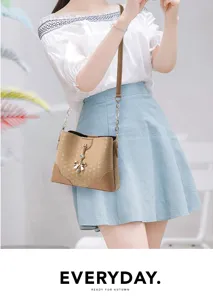Borsa secchiello da donna elegante con fiocco chic e tracolla pratica per uso quotidiano.