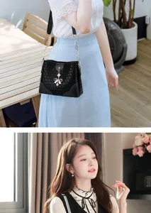 Elegante borsa a secchiello a tracolla nera con catena e ciondolo a fiocco per la moda donna.