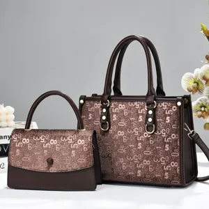 Detailed view of the elegant brown monogram tote bag set with premium texture and metal hardware.