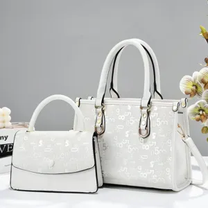 Detailed view of the white tote bag and matching purse set with chic pattern for daily commute.