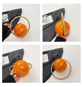 Acryl planeet gevormde avondtas met gouden ringhandvat oranje marmeren clutch tas