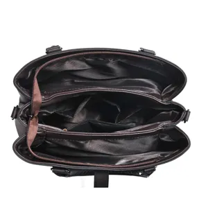 Detailed view of the multi-compartment brown tote bag interior, showing organized storage and lining.