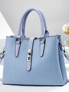 Elegant blue woven shoulder handbag with metal lock design, spacious tote for women daily use.