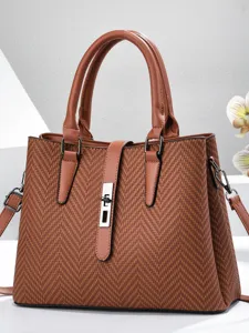 Elegant brown textured handbag for women with top handles and chic metal lock closure.