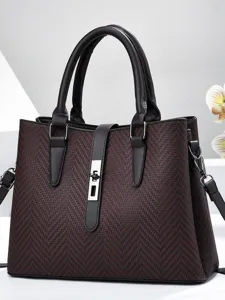 Elegant women's handbag with secure lock closure and spacious multi-compartment design.