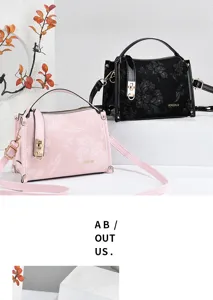 Detailed view of stylish floral embossed PU leather handbag in pink and black colors.