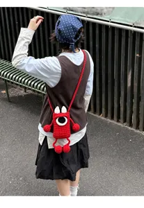 Cute handmade knitted crochet monster phone cross-body bag for women and kids casual daily use.