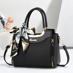 Elegant black women tote handbag with stylish silk scarf accessory, perfect for daily fashion.