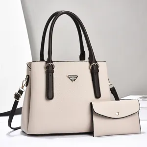 Elegant beige leather tote bag set with brown handles and matching pouch for women daily use.