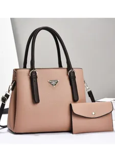 Fashionable large capacity leather tote bag set with shoulder strap and matching pouch.