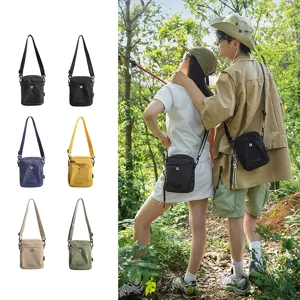 Detailed outdoor scene view of stylish cross-body shoulder bag featuring multiple color options.