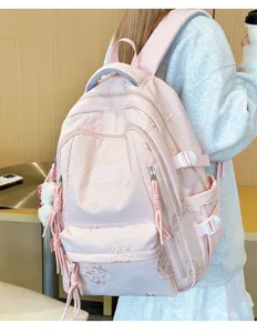 Zaino rosa di grande capacità con ricamo delicato e tasche multiple per la scuola.