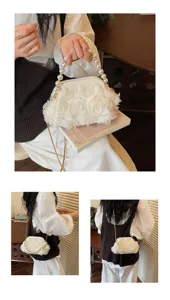 Elegant white floral kiss-lock evening bag with pearl handle and stylish chain strap.