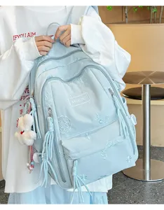 Zaino per studenti stile college azzurro chiaro con ricami delicati e grande capacità.