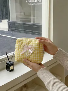 Yellow plaid quilted cosmetic bag with cute heart lace bow for daily makeup storage.