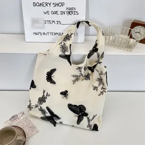 Sac cabas en toile avec elegante broderie de papillon en dentelle noire, grand sac a epaule casual.