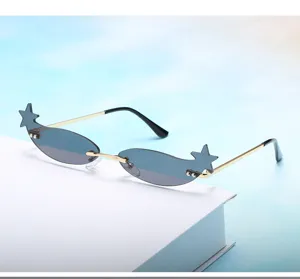 Star rimless sunglasses detail view, narrow metal frame fashion eyewear for street styling.