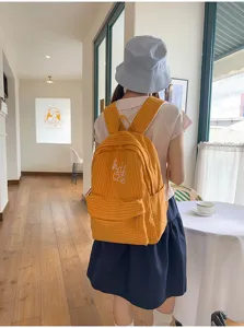 Japanese INS plaid large capacity student school bag backpack for women with embroidered letters.
