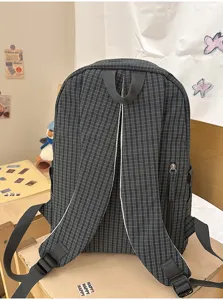Japanese Harajuku style grid large capacity student schoolbag backpack for daily use.