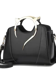 Black women shoulder handbag with stylish gold metal handle, fashion commuter daily bag.