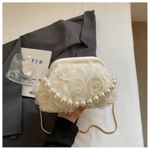 Elegant women evening bag with pearl handle, floral fabric design, crossbody shoulder bag chic.