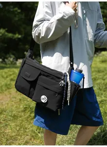 Unisex black nylon crossbody messenger bag with multi pockets, casual outdoor student shoulder bag