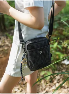 Trendy outdoor plaid crossbody bag for men and women, perfect for commuting, travel, and cycling.