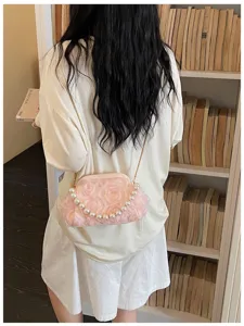 Exquisite sweet style women shoulder crossbody bag with pearl handle and flower details.
