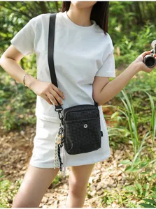 Trendy outdoor plaid messenger bag for women, casual black small square bag for commuting travel.