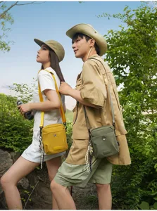 Trendy outdoor cross-body small square bag, durable fabric, adjustable strap for travel.