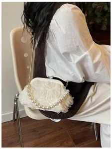 Exquisite sweet style women's evening shoulder bag with floral and elegant pearl handle.