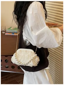 Sweet style white evening shoulder bag featuring fabric rose flowers and elegant pearl handle.
