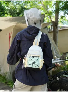 Detailed outdoor colorblock casual backpack with drawstring and multi-pocket design.