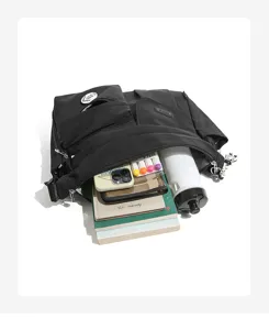 Nylon messenger bag detail showing spacious interior capacity, multi-pocket design, daily use.