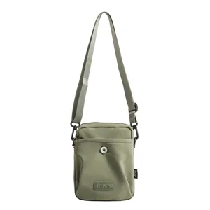 Olive green unisex small crossbody shoulder bag for outdoor travel and daily commuting.