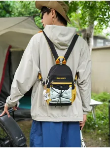Outdoor backpack lifestyle detail shot showing contrast color design and pocket setup.