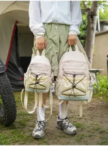 Outdoor color-block casual couple backpack lightweight nylon daypack with front bungee cords.