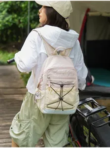 Detailed view of the color-block outdoor backpack with multi pockets and drawstring feature.