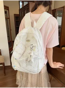Mochila escolar japonesa linda de gran capacidad con colgantes de estrellas y bolsita para chicas.